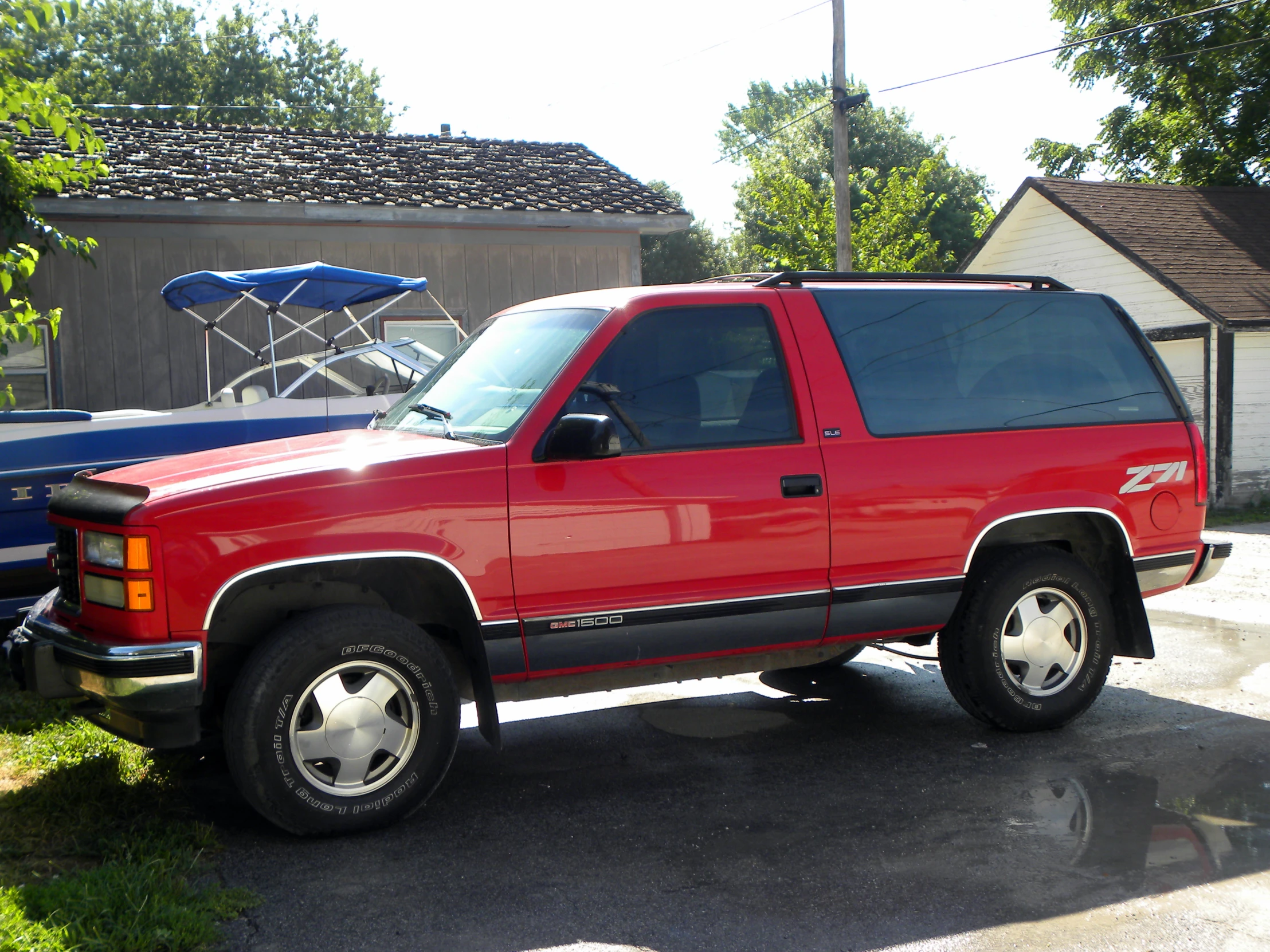 the truck has the small blue trailer on it's back tire