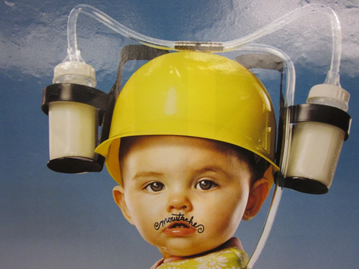 a po of a child wearing a construction safety helmet with the words genius on it