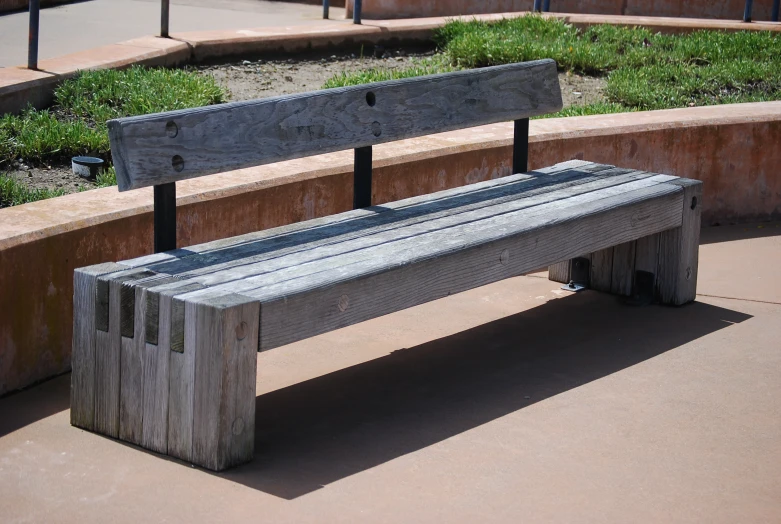 a wood bench that is made from planks