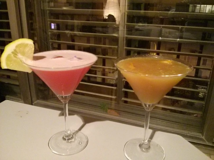 two drinks with different colored liquids near each other