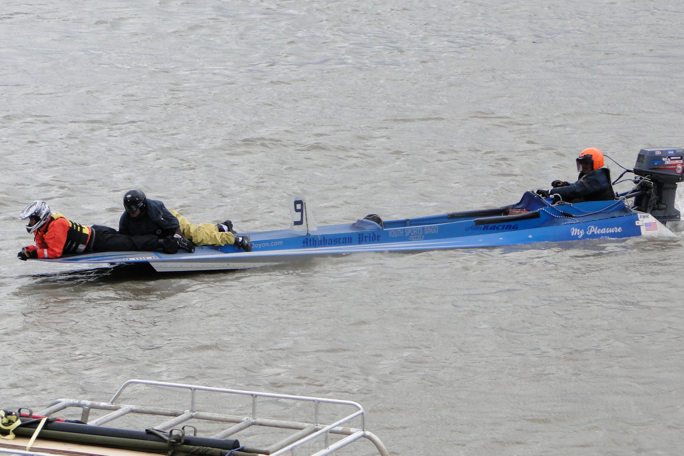 an individual in a blue boat on the water