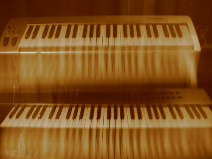 a golden piano sits in a brown and tan lit room
