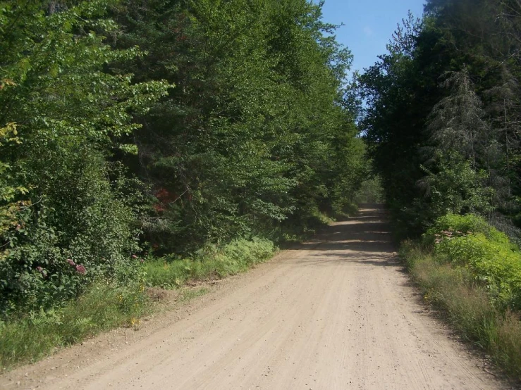 the dirt road is very wide and narrow