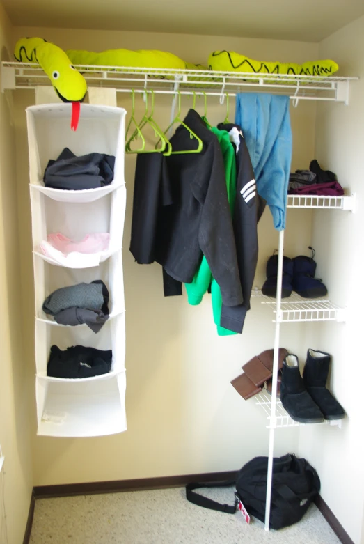 there is a closet with a small shelf and a row of shelves