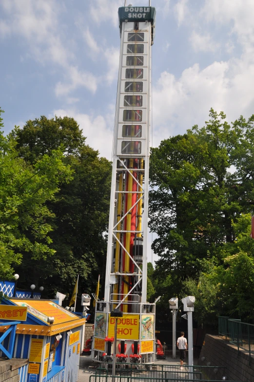 a tall metal structure with a large sign on it