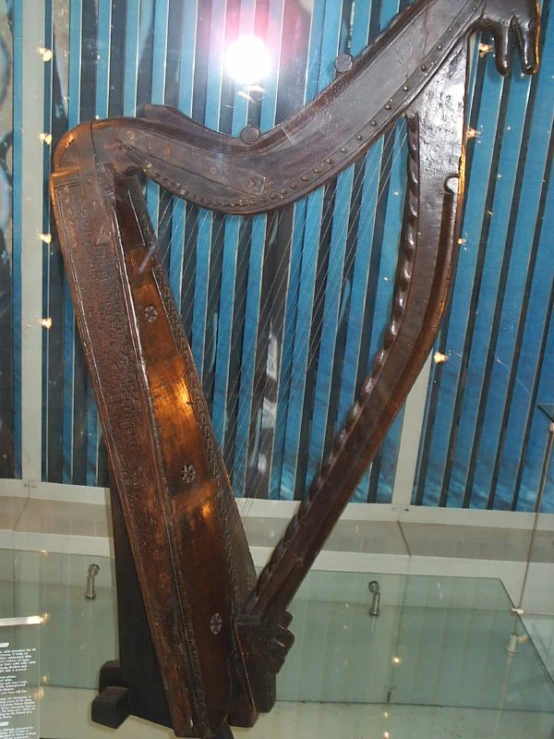 there is a large metal musical instrument in a display case