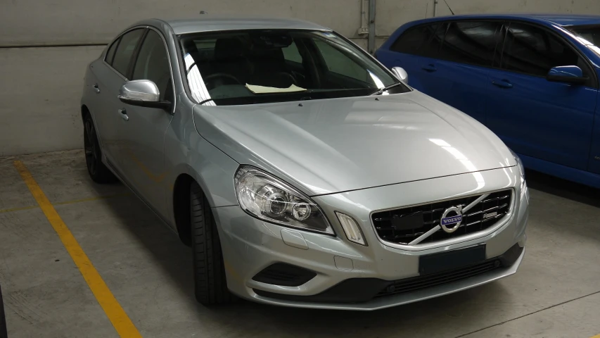 the volvo car is parked in the garage