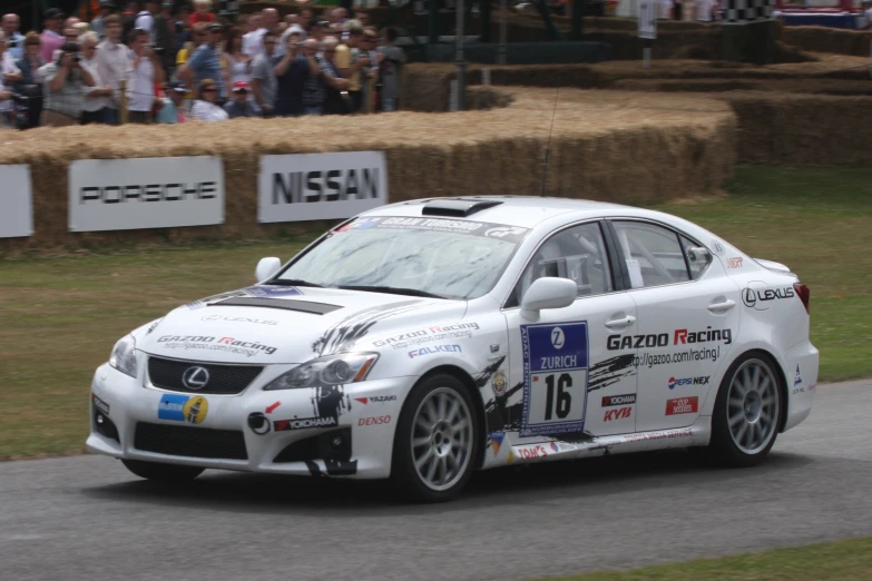 a man drives his car on a race track