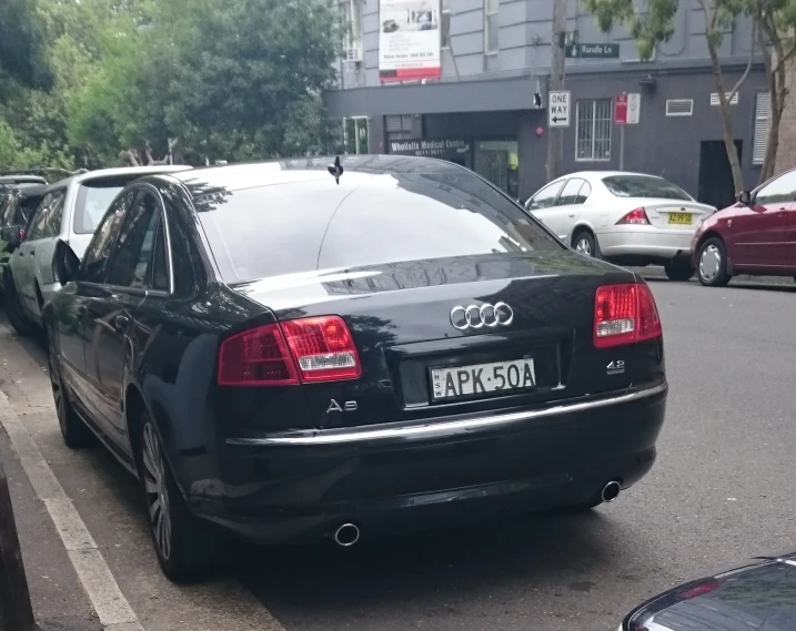 the rear end of an audi in a parking lot