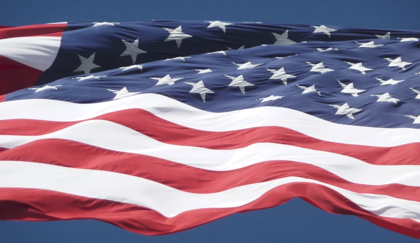 a closeup of an american flag with white stars