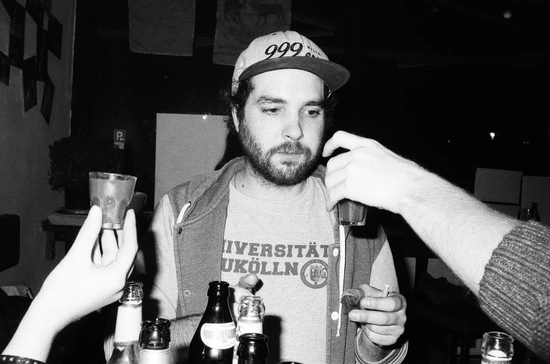 three people having a drink at a table