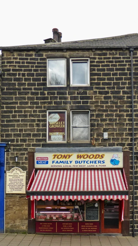 a brick building that has an awning over it