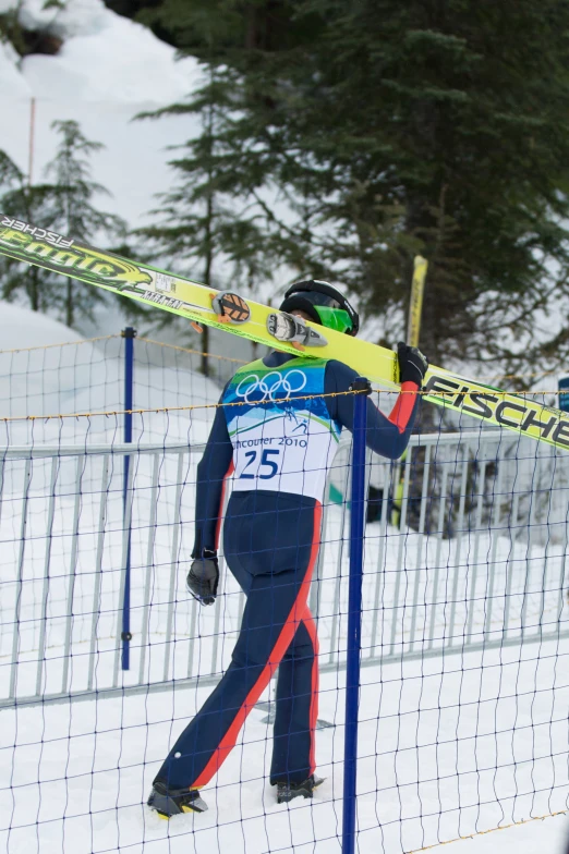 a person skiing up a snow covered hill