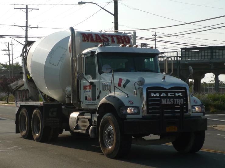 a cement truck driving down the road