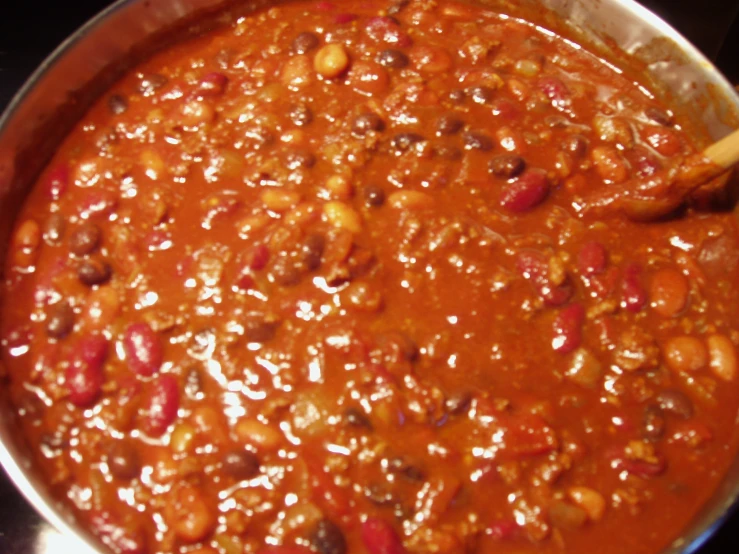 beans and rice in a large saucepan with spoon