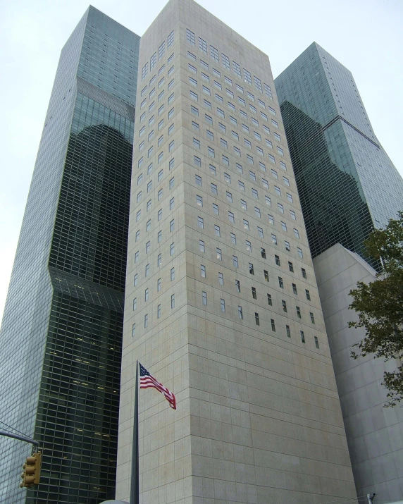 two buildings side by side with a flag on one side