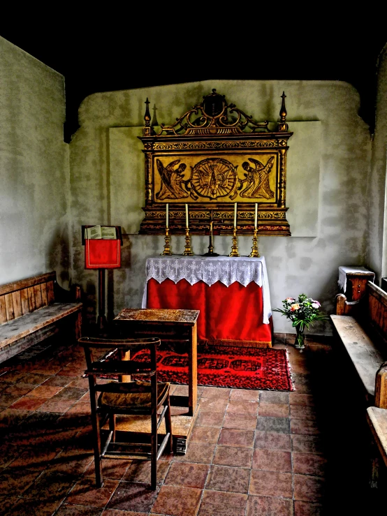 a room with a table and a red and white chair in it