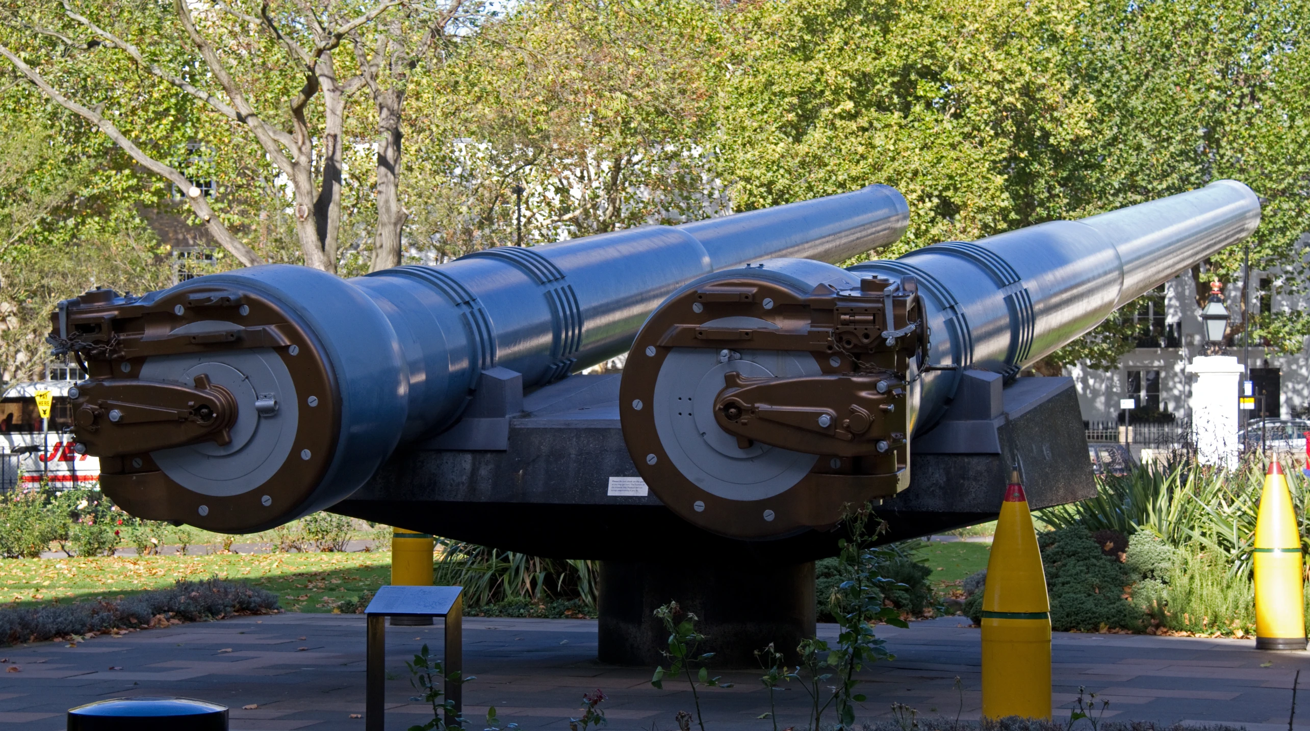 the large artillery is sitting on display in a park