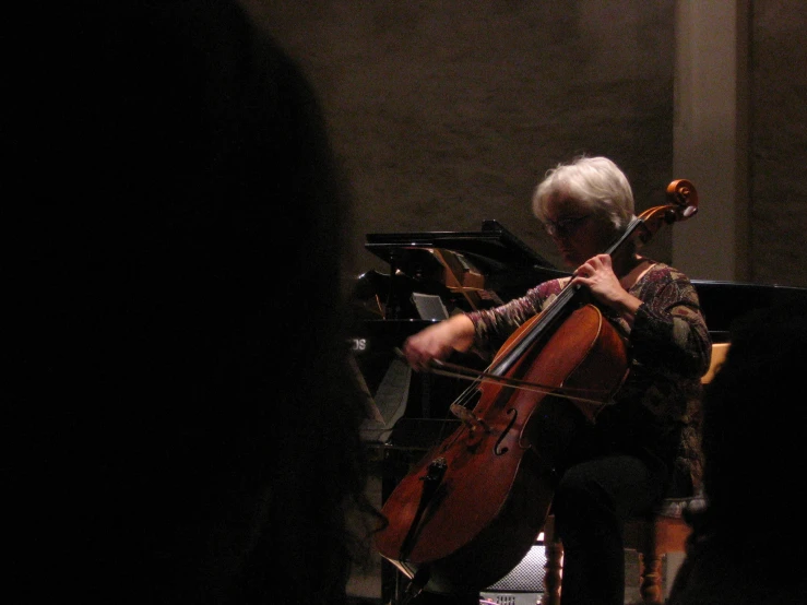 a man is playing the violin with his hands