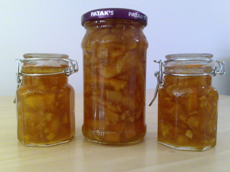 three glass jars with some type of food in them