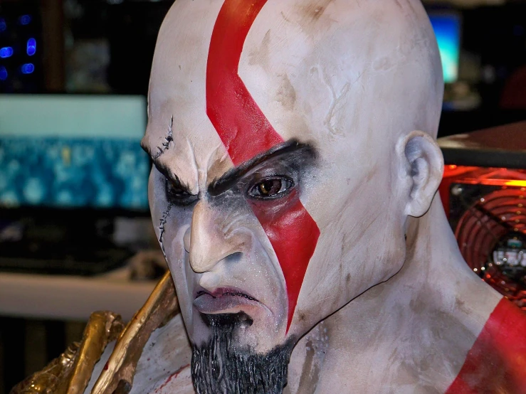 a man with a face painted like the god god of war