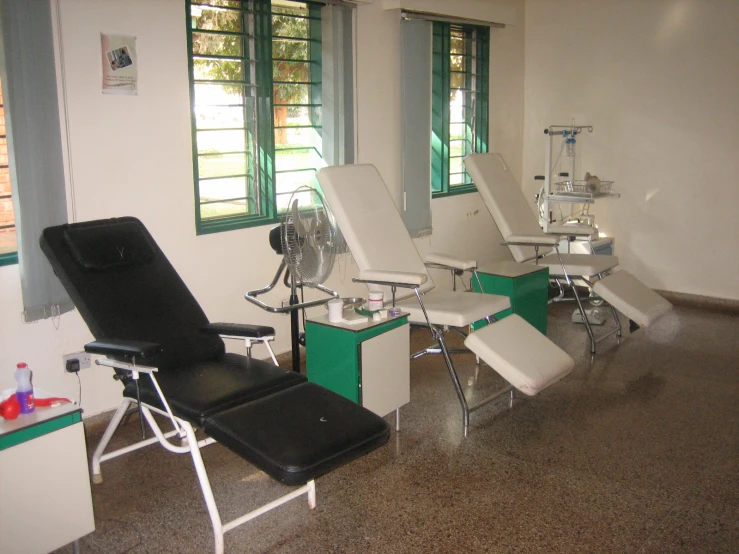 a room with several different types of chairs