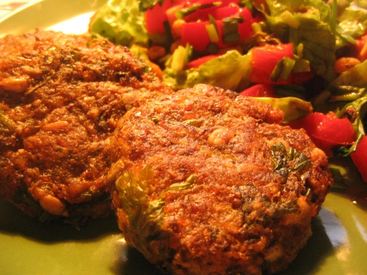 some sort of food on a plate with salad