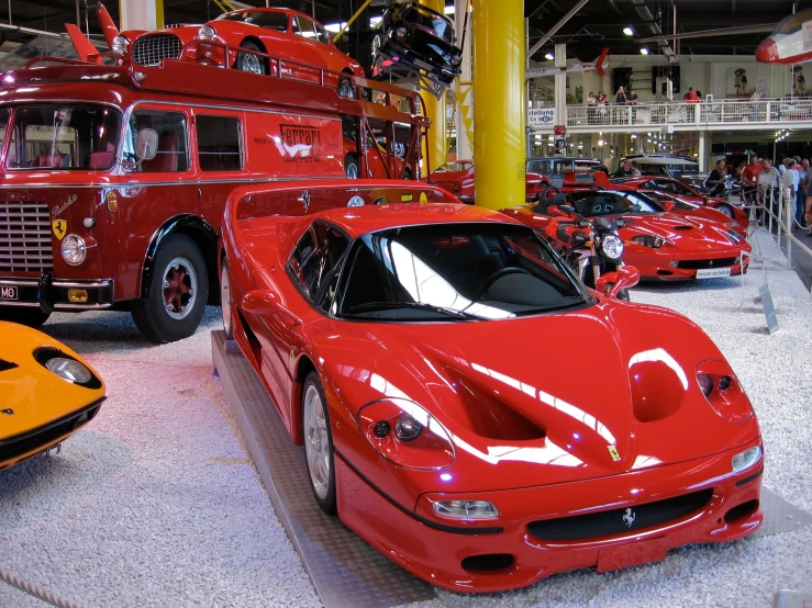 red cars line up in a showroom to get the best out of the firetruck