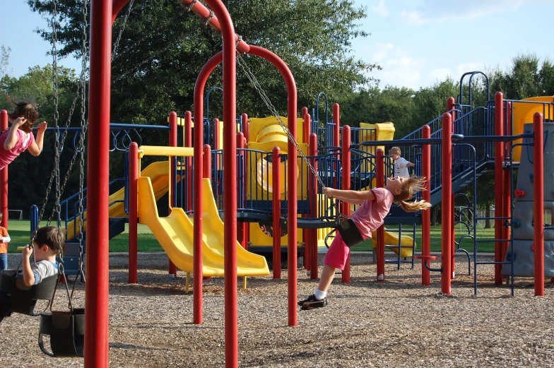 the children are playing at a playground