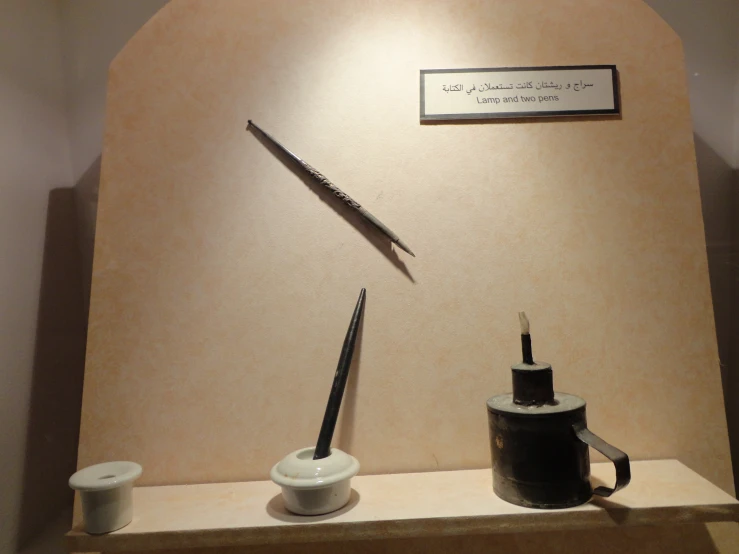 a museum display of two black and white objects