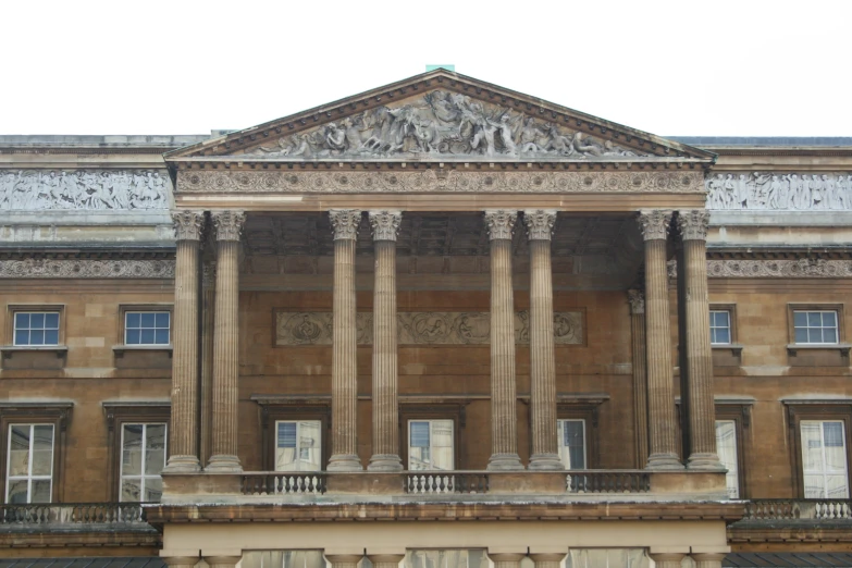 large building with decorative pillars and columns at front of it