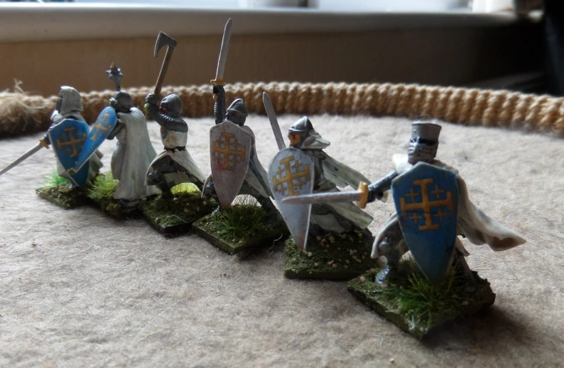 miniature knights, all dressed in their medieval dress