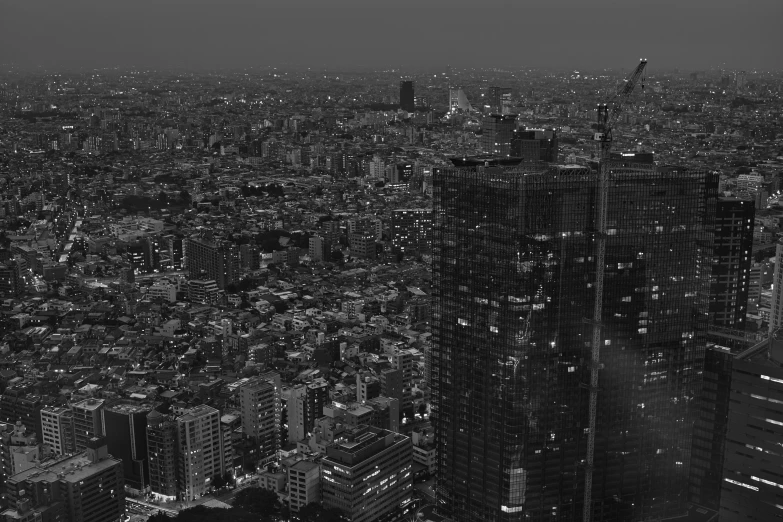 a cityscape of skyscrs and office buildings all lit up at night