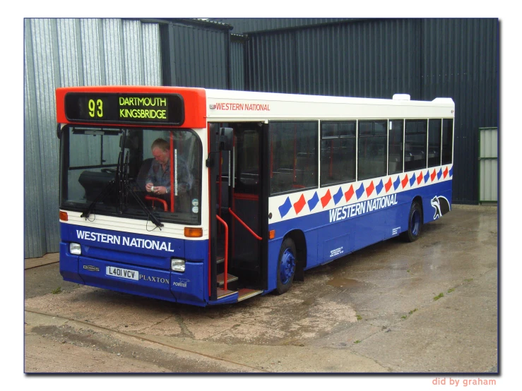 the bus has been parked in front of the building