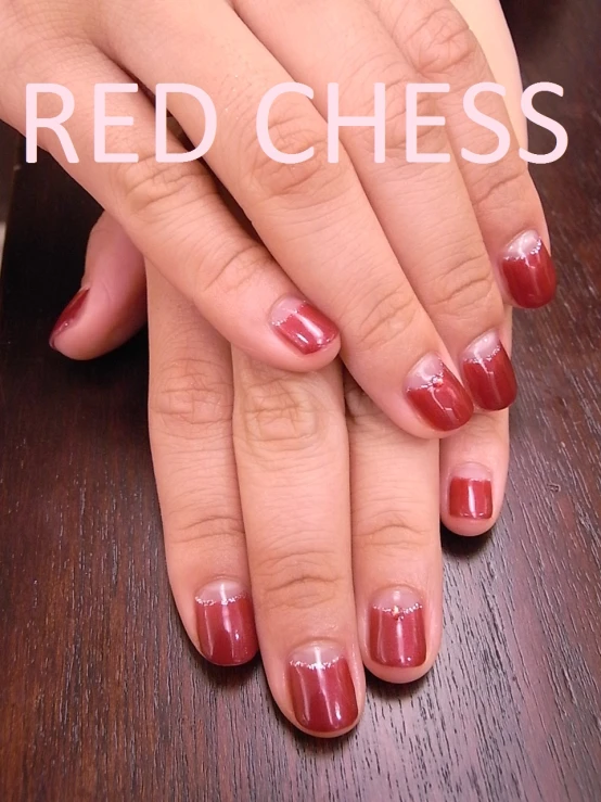 womans red manicure nails with text that reads, red chess