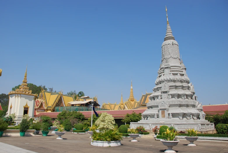 the large pagoda is surrounded by many planters