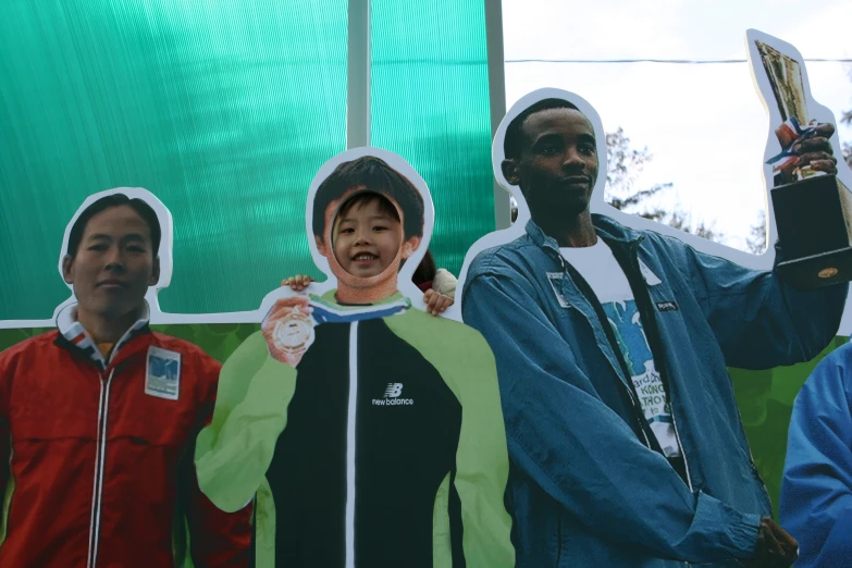 an advertit for the olympic games is shown with four men