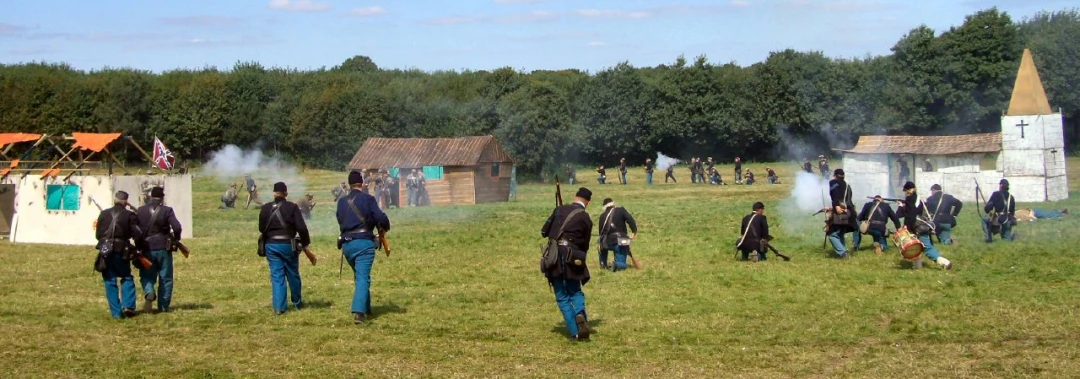 men standing on top of a field with a group of people