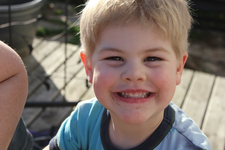 a  with a white tooth standing on a sidewalk