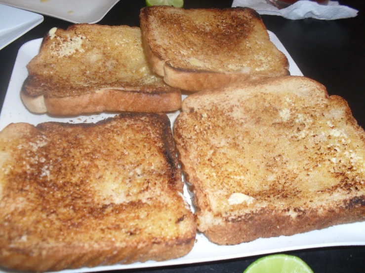 toasted sandwiches are set on a plate