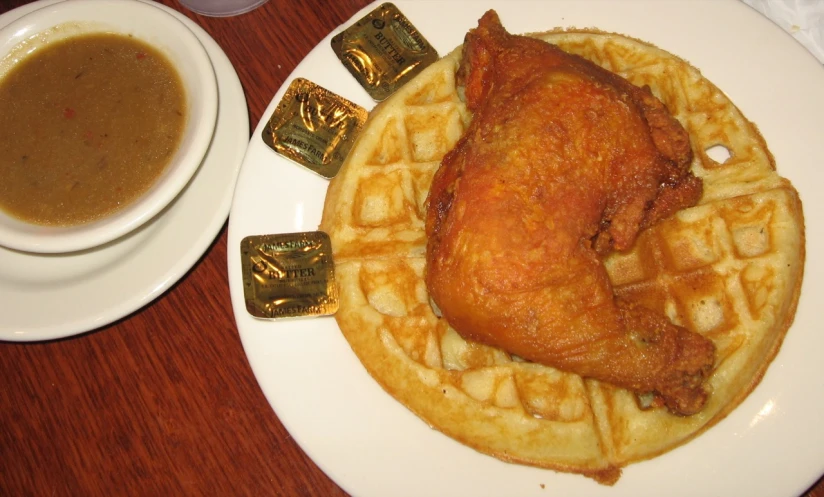 a close up of a plate of food with a drink