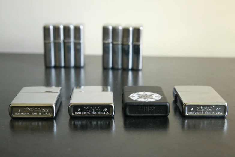 five different types of mini - sized silver and black magnets