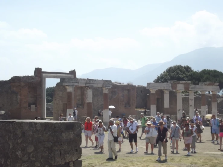 people standing in a square and some are walking around