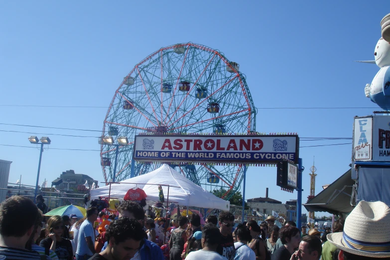 many people are gathered at the fairground