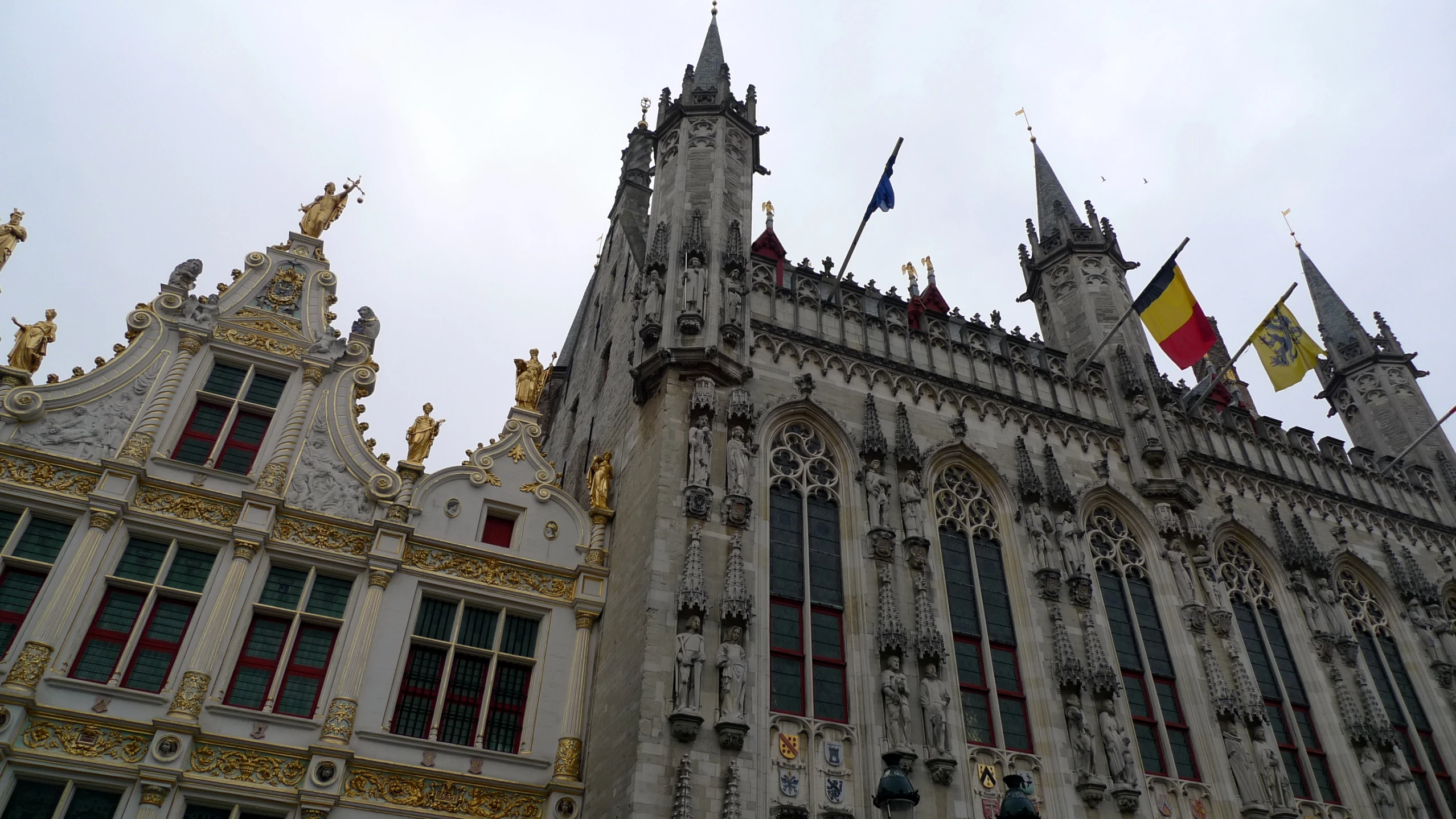 the large building has many ornate gold and white designs on it