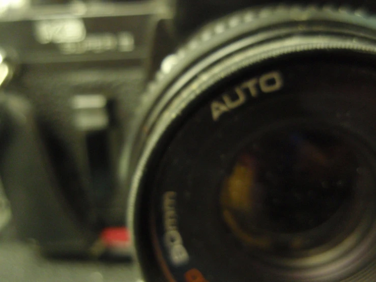 the reflection of an auto meter on a camera