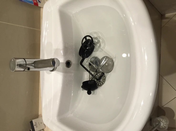 an electronic device on top of a bathroom sink