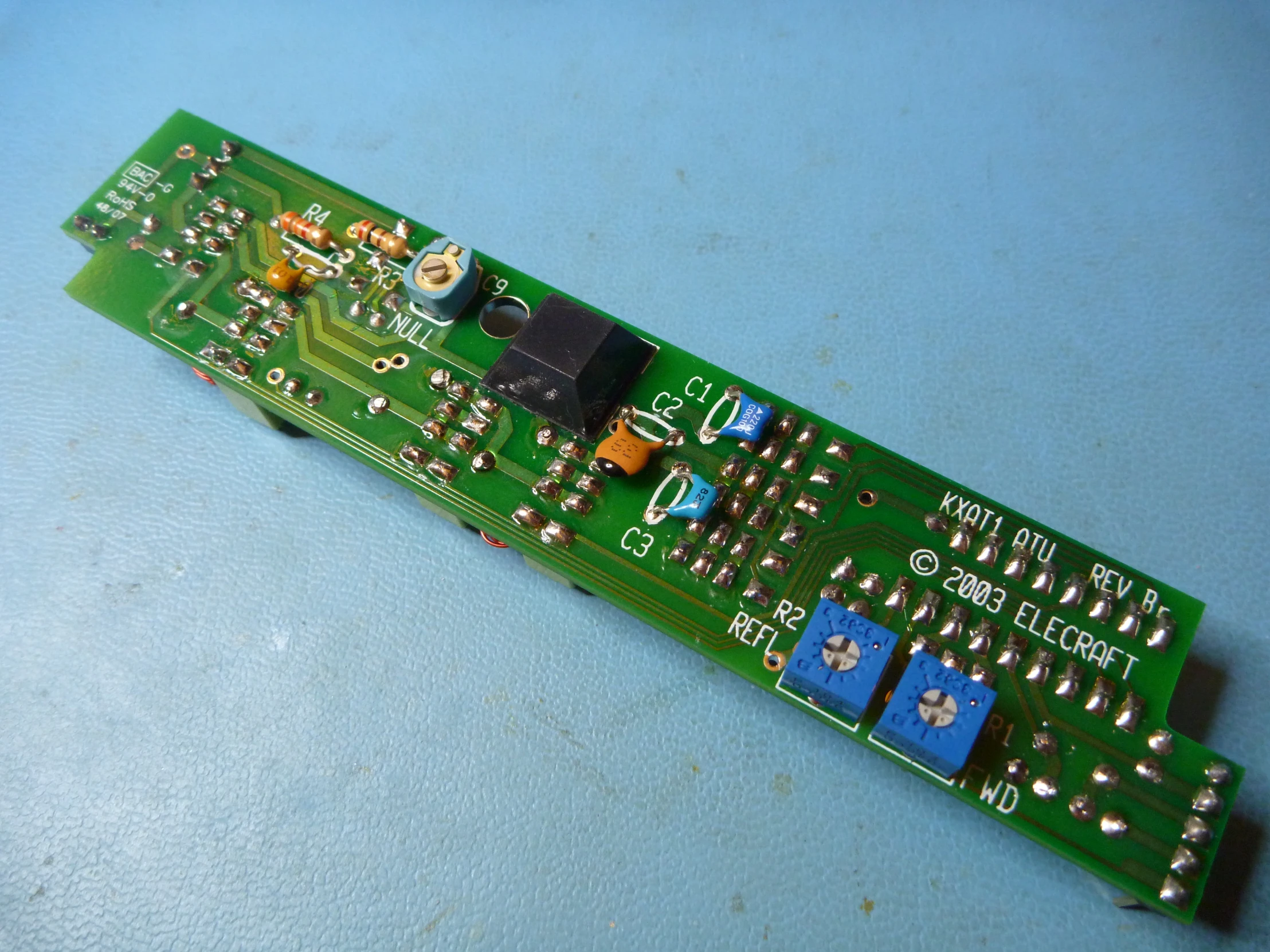 a close up view of a green electronic board