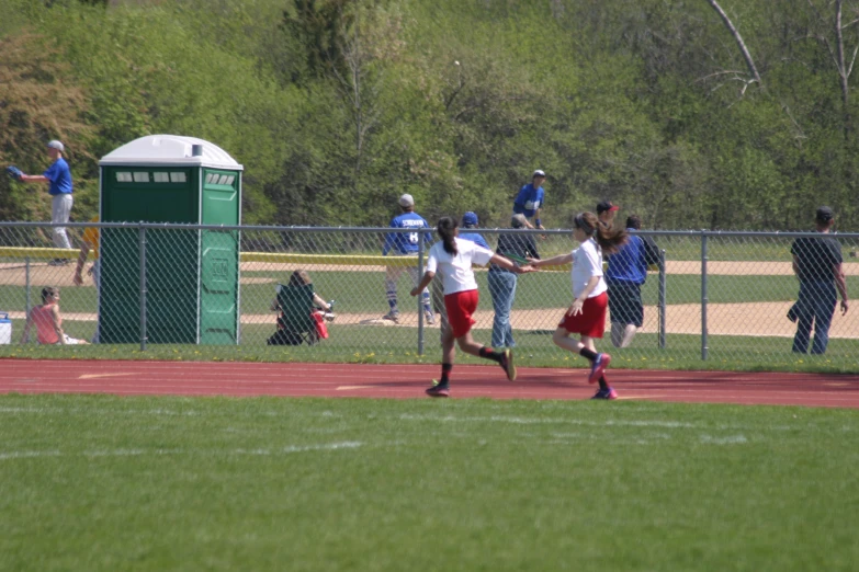 two s who are playing a game of frisbee