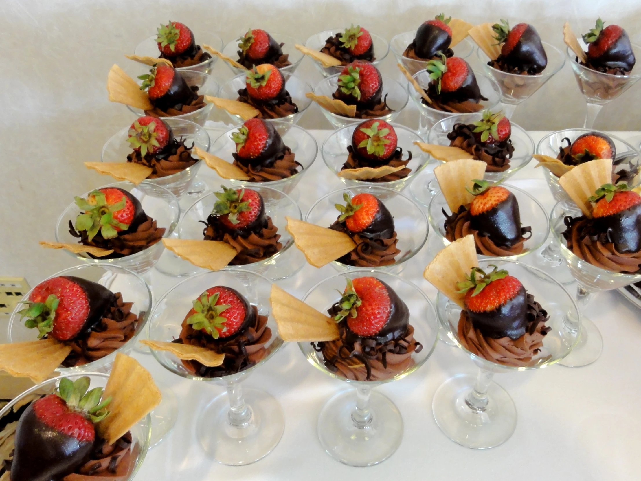 a plate full of strawberries and chocolate desserts